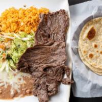 Carne Asada Plate · Thin steak flap meat (Ranchera) served w/rice and beans,one cheese enchilada and guacamole.T...