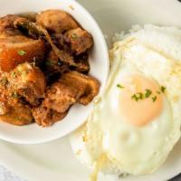 Pork Adobo · Pork meat slowly cooked in vinegar and soy. Served with rice or garlic fried rice and egg.