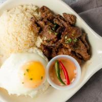 Tapsilog · Pan fried marinated steak, served with white rice or garlic fried rice and egg.