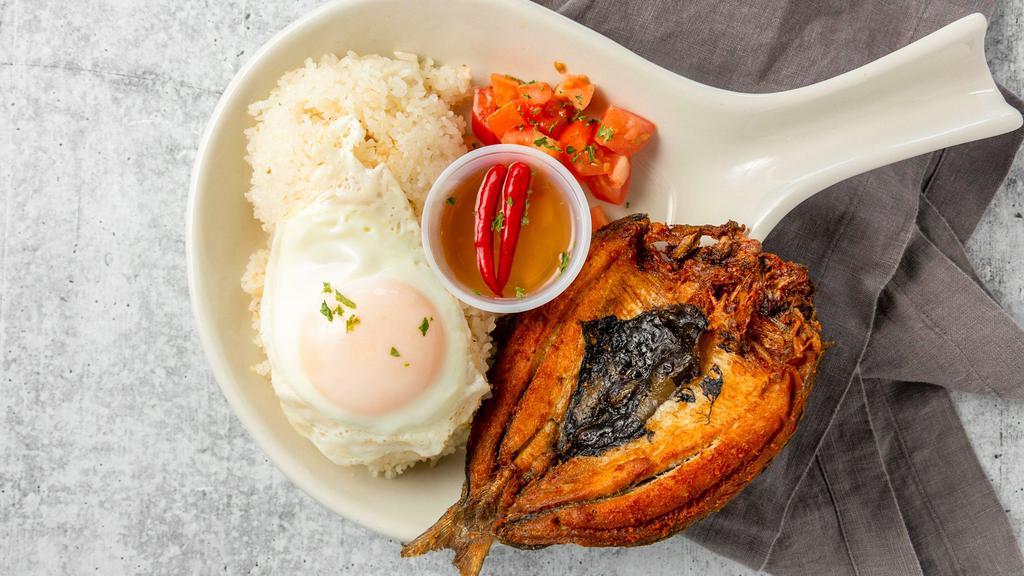 Bangsilog · Fried marinated bangus (milkfish), comes with steamed white rice or garlic fried rice and a piece of egg.