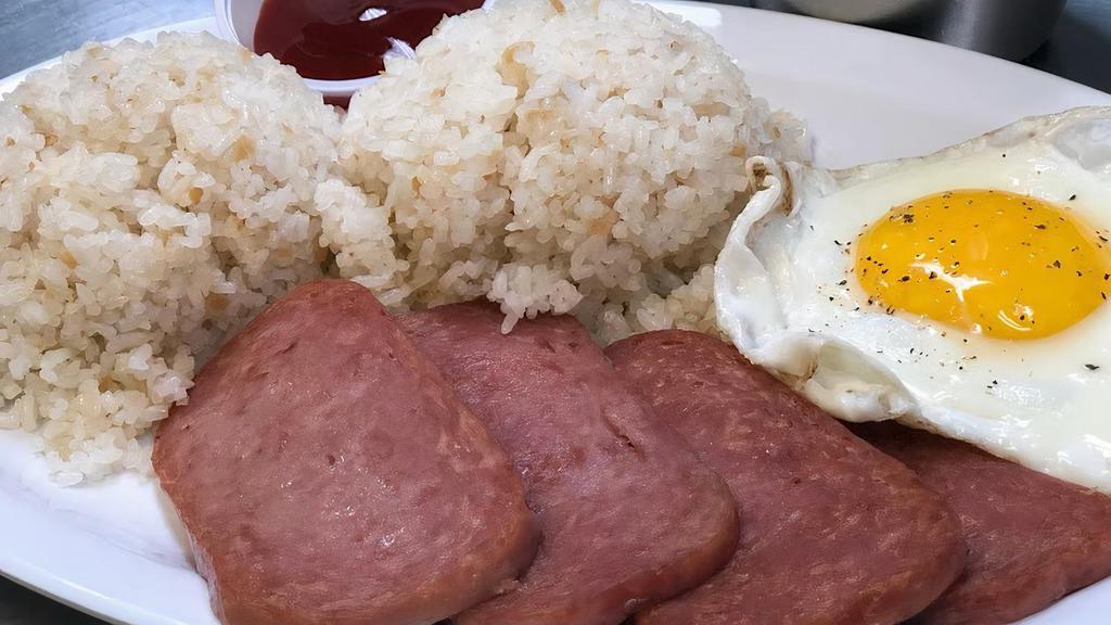 Spamsilog · Fried spam serve with steamed white rice or garlic rice and a piece of egg.