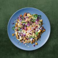 Veggie Samosa Chaat  · Classic samosas, crushed and mixed with hot, sweet, and tangy sauces, yogurt and topped with...