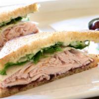 Smoked Turkey Sandwich · Top menu item. Smoked turkey breast, Brie spread, seasonal pears, arugula, and cranberry hon...
