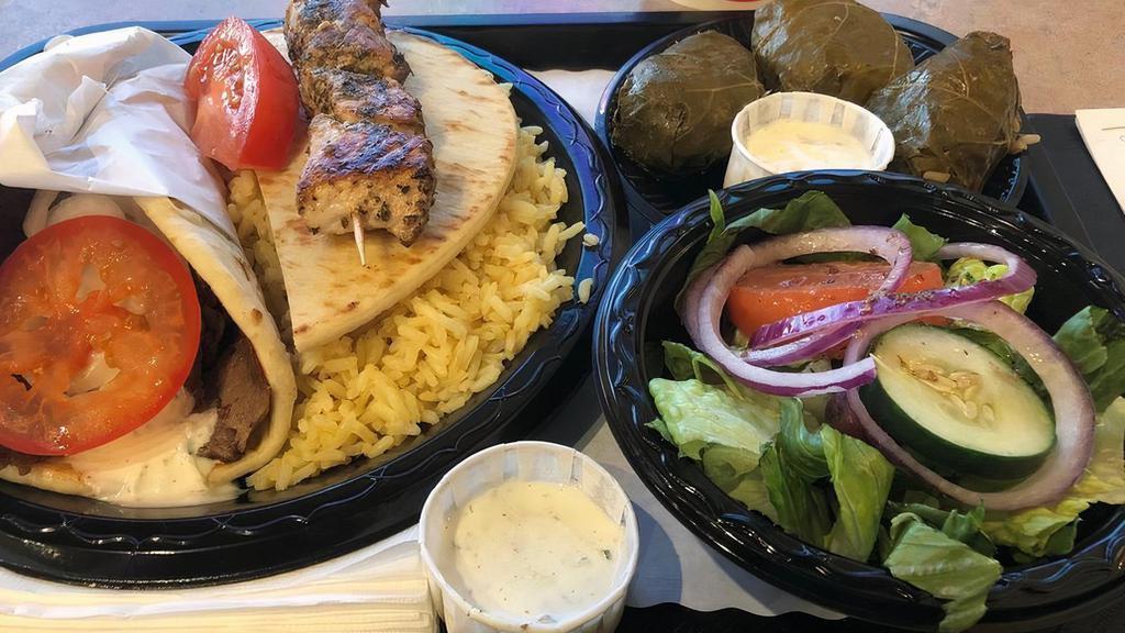 Greek Combo · Gyro sandwich (beef with lamb, chicken or veggie), and pork or chicken souvlaki; served with rice pilaf or french fries and a dinner salad.