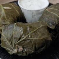 Dolmades · Grape leaves (3) stuffed with a meat and rice mixture, served with tzatziki sauce.