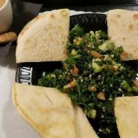 Tabbouleh · Vegetarian ~ Salad made with bulgur wheat, fresh parsley, tomatoes, cucumbers and mint, serv...