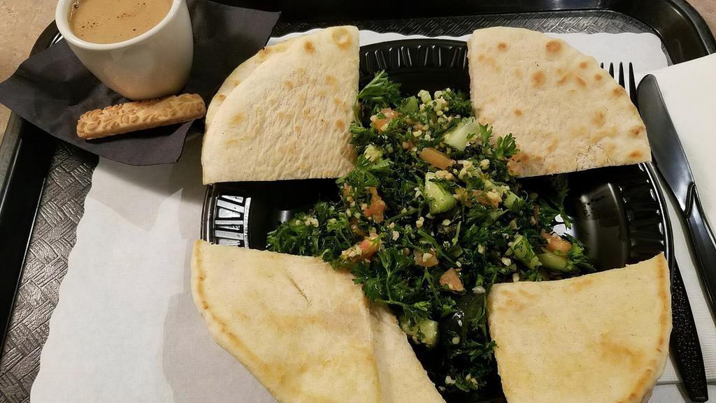 Tabbouleh · Vegetarian ~ Salad made with bulgur wheat, fresh parsley, tomatoes, cucumbers and mint, served with grilled pita.