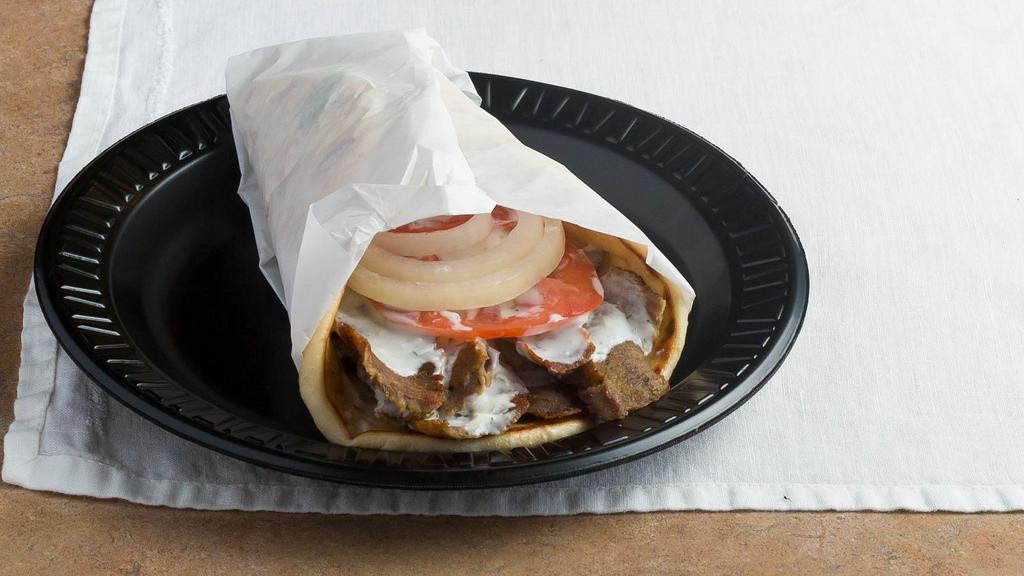 Gyro Sandwich · Thin sliced gyro meat (beef with lamb) rolled up in a grilled pita with tzatziki, tomato and onions