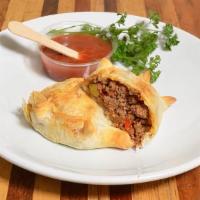 Criolla Empanada · Spicy. Spicy ground beef, caramelized onions, peppers, and olives. Add sauce for extra charg...