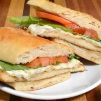 Milanesa De Pollo Sandwich · Thinly sliced chicken breast, lightly breaded, and seasoned. Served on a baguette with lettu...