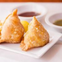 2) Samosas (2 Pcs.) · Two mildly spiced deep fried pastries.