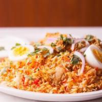 96) Egg Biryani (Gf) · Gluten-free.  Hard-boiled egg cooked with basmati rice and aromatic spices.
