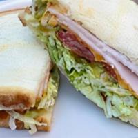 Copa Club Sandwich Includes Chips · Turkey, bacon, cheese, tomato, lettuce, pickle, mayo. On white or sourdough bread.