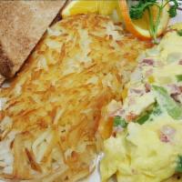 Spanish Omelet · Ham, green pepper, onion, tomato, Tillamook Cheddar Cheese and mild salsa. Choice of toast.