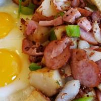 #10 Home Style Skillet · Served with two eggs, ham, diced potatoes, german sausage, bacon, green peppers, and onion.
