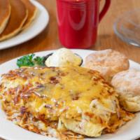 Stuffed Hash Browns · Served with Golden brown hash browns stuffed with ham, tillamook cheddar cheese, and scrambl...