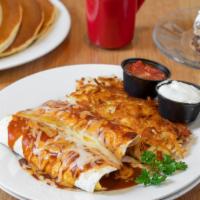 Breakfast Enchiladas  · stuffed with eggs, bacon, green chilies, onion and cheese. Topped with our house made enchil...
