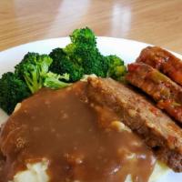 Homemade Meatloaf · MEATLOAF MADE IN HOUSE, SERVED WITH FRESH VEGETABLES, SEASONED MASHED POTATOES, AND BROWN GR...