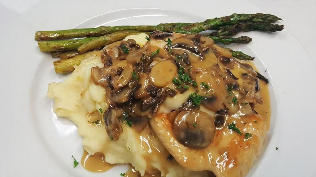 Chicken Marsala · TWO PAN SEARED CHICKEN BREASTS SAUTÉED WITH MUSHROOMS AND CAPERS IN A CREAMY MARSALA SAUCE. TOPPED WITH THINLY SLICED PROVOLONE MELTED ATOP THE CHICKEN BREAST. SERVED OVER MASHED POTATOES AND GRILLED ASPARAGUS