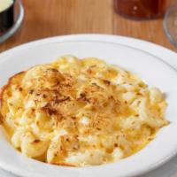 Baked Mac & Cheese · A TWIST ON THE TRADITIONAL FAVORITE – A THICK WHITE CREAM SAUCE HOMEMADE FROM SCRATCH, COMBI...