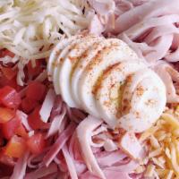 Chef Salad · A mound of garden greens topped with ham, turkey, Swiss and Tillamook cheddar. Garnished wit...