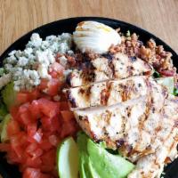 Cobb Salad · Tender grilled chicken breast on fresh garden greens with bacon, avocado, tomatoes, blue che...