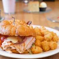 Smoked Turkey Bacon Swiss Croissant · Smoked deli turkey, fresh bacon and Swiss cheese with lettuce and tomato on a delicate puff ...