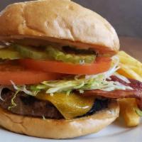 Bacon Cheeseburger · Topped with Cheddar Cheese and 2 strips of bacon, served with lettuce, tomato, special dress...