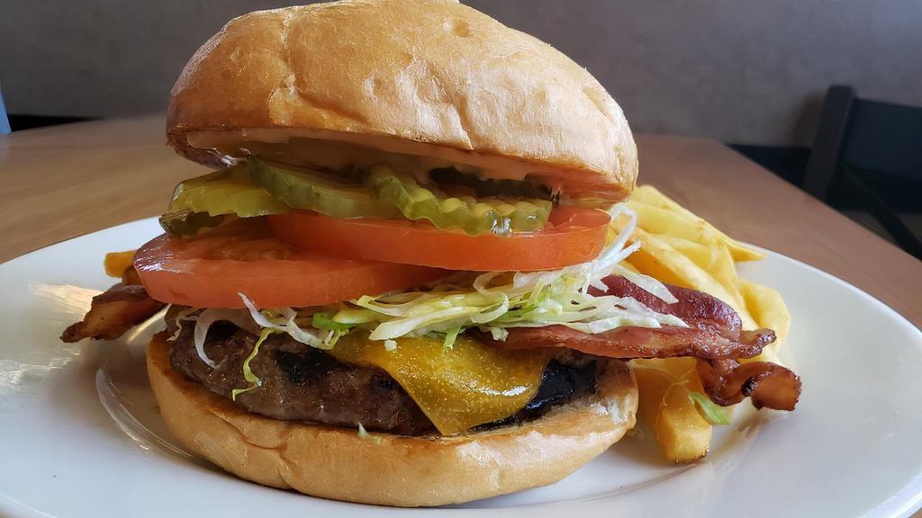 Bacon Cheeseburger · Topped with Cheddar Cheese and 2 strips of bacon, served with lettuce, tomato, special dressing and pickles. Served with choice of side.