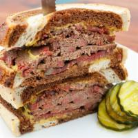 Corned Beef · Half a pound of house made corned beef brisket with spicy brown mustard on marbled rye.