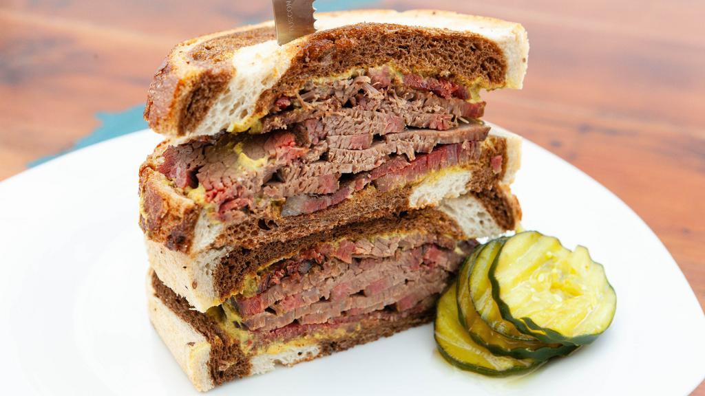 Corned Beef · Half a pound of house made corned beef brisket with spicy brown mustard on marbled rye.