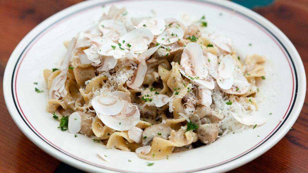 Mushroom Stroganoff · Egg noodles, mushroom cream, a variety of mushrooms, parmesan, chives.
