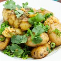 Smashed Fingerlings · Smashed fingerling potatoes cooked in butter and tossed in chimichurri.  -Vegetarian and Glu...