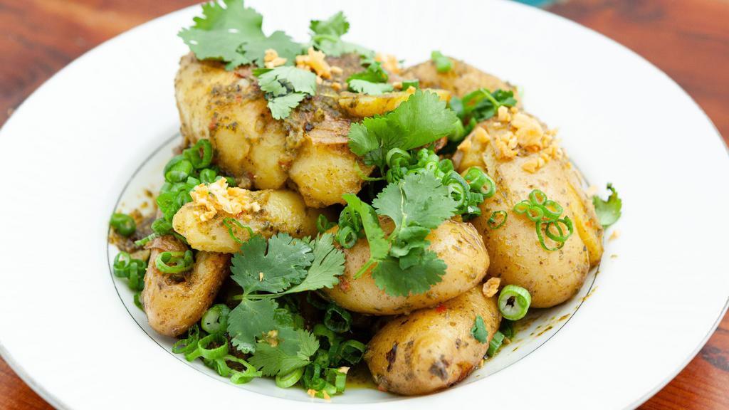 Smashed Fingerlings · Smashed fingerling potatoes cooked in butter and tossed in chimichurri.  -Vegetarian and Gluten-free.