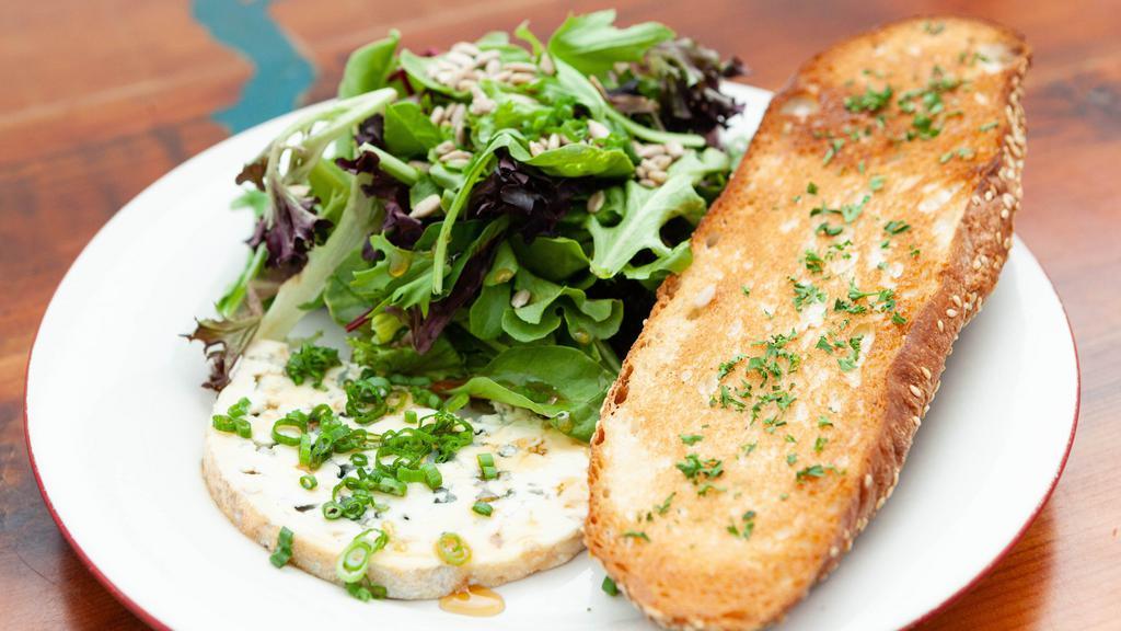 D'Ambert Blue & Greens  · Creamy blue cheese drizzled with honey, seasonal greens, balsamic vinaigrette & grilled bread.
