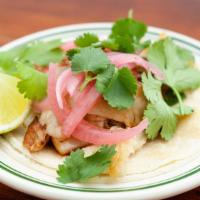 Chicken Taco · Gochujang marinated chicken, onions, cilantro, sesame seeds, corn tortillas. - Gluten-free.