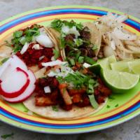 Soft Tacos (Individual) · Served with cilantro and onion and limes and radishes on side. Two warm corn tortillas per t...