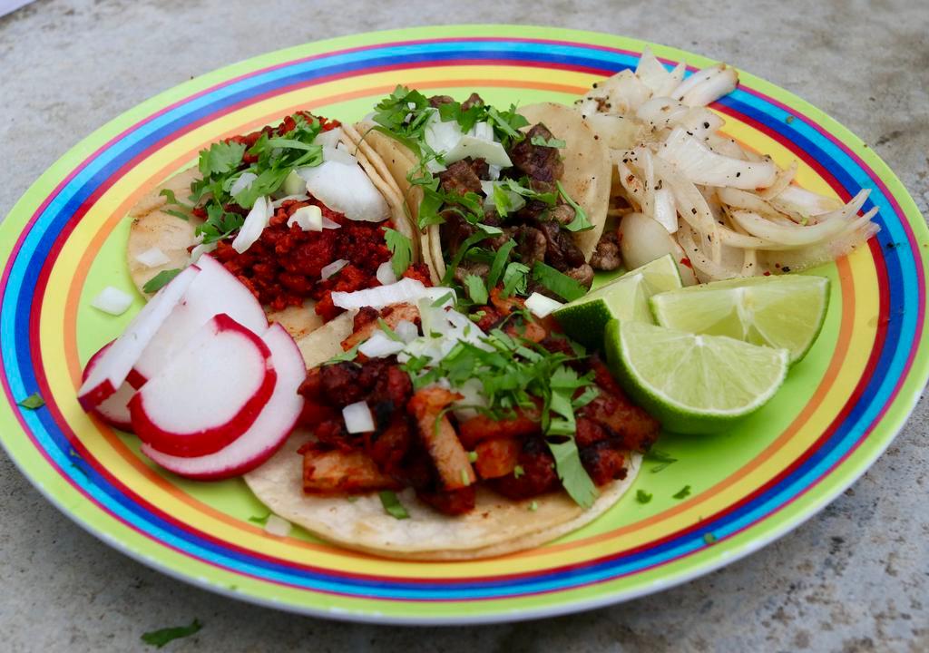 Soft Tacos (Individual) · Served with cilantro and onion and limes and radishes on side. Two warm corn tortillas per taco.