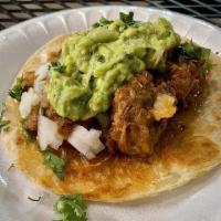Brisket Tacos · Smoked brisket, BBQ sauce, cilantro, onion.