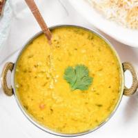 Yellow Tadka Dal · Yellow lentils simmered overnight with herbs and spices.