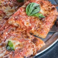 Square Cheese Pizza · Tomato sauce, fresh, and aged mozzarella, parm, and fresh basil.