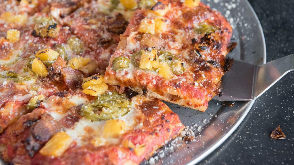 Square Weekend At Dino'S Pizza · Tomato sauce, fresh and aged mozzarella, Zoe's bacon, pineapple and house pickled jalapenos.