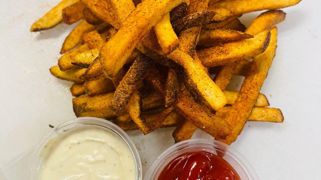 Seasoned Fries · Fries tossed in our house made spices served with our house made garlic aioli