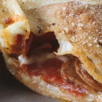 Meat Lovers Calzone · pepperoni, spicy sausage, Canadian bacon, & mozzarella