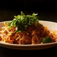 Chicken Pad Thai · A classic Thai noodle dish with chicken, fried tofu, egg, peanuts, chives, and thin rice noo...