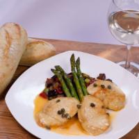 Pollo Al Piccata · Chicken breast in a lemon butter white wine sauce and capers. Served with vegetables.