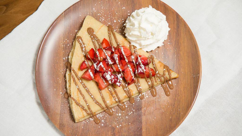 Build Your Own Crepe Or Waffle · Sweet French influenced crepe or a warm waffle. Choose from our delicious chocolates. Pick your fruit puree and add bananas or strawberries.