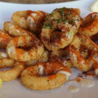 Petra Calamari · Deep-Fried Calamari topped with house Garlic sauce and Garlic Ketchup sauce. Garnished with ...