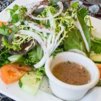House Salad · Tossed crisp greens mixed with veggies. Topped with our House Dressing.