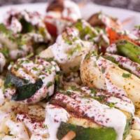 Veggie Kabobs · Charbroiled Veggie Kabob seasoned with our house spices. Served over a bed of rice, topped w...